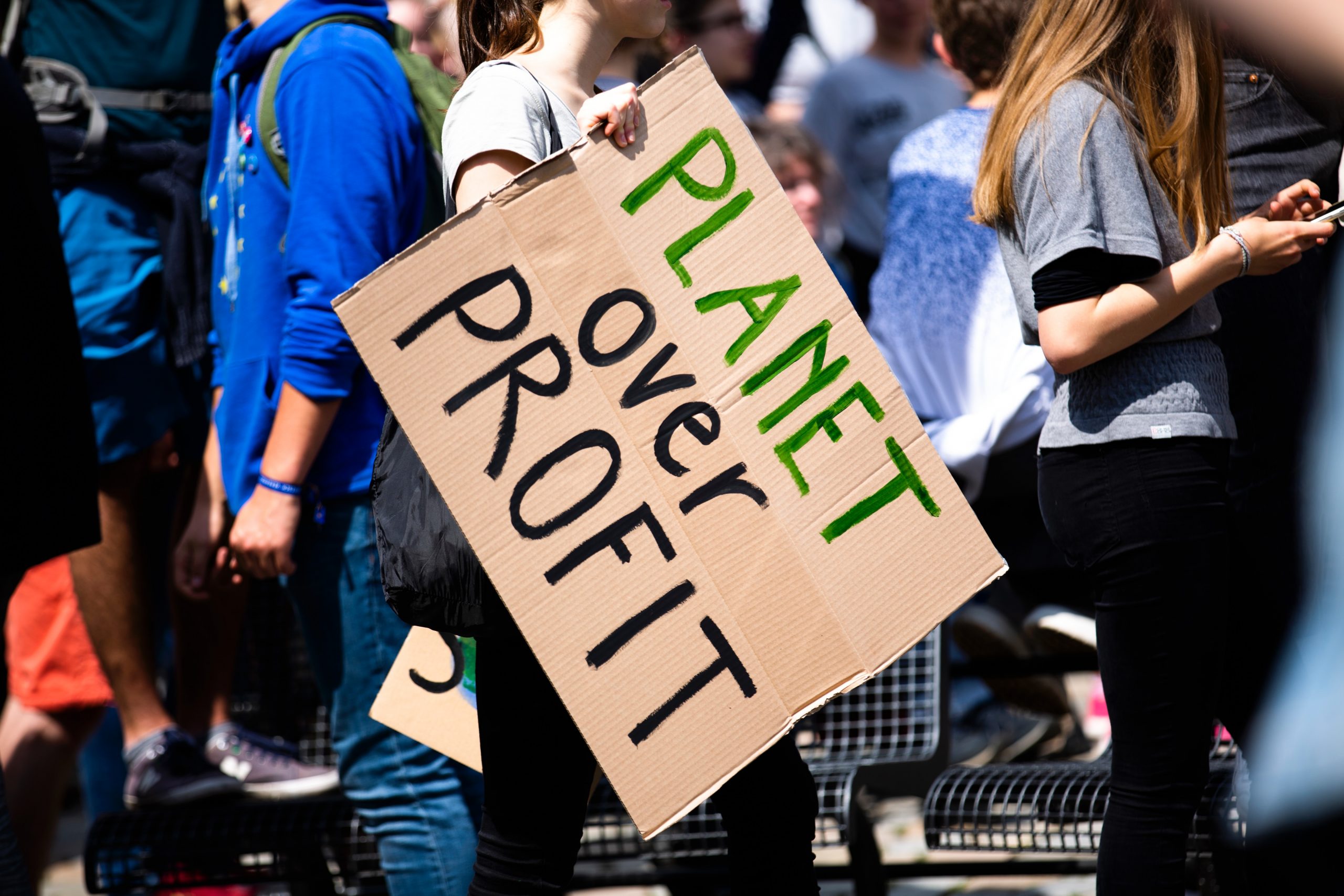 Placard reading 'planet not profit'